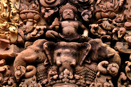 Bas relief at the Banteay Srei temple in pink sandstone representing Indra on its three headed elephant