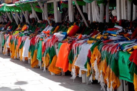Stands selling prayer flags at flee market in Barkhor Square, Lhasa