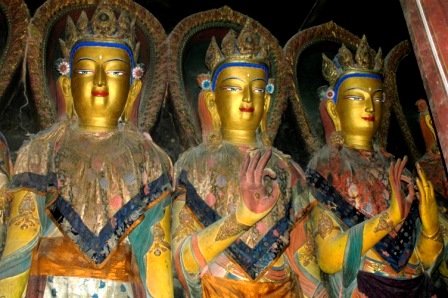 Three Buddha statues inside chapel in Gyantse Kumbum